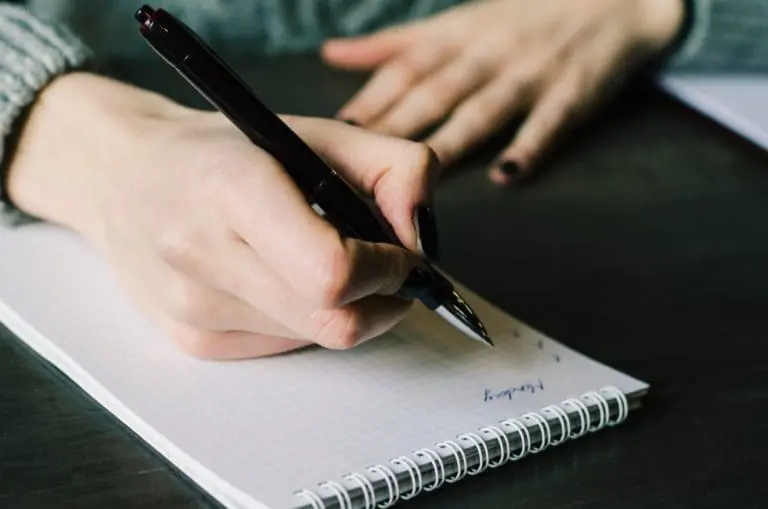notebook and pen working write business woman