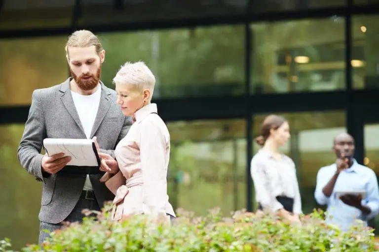 Successful Business People Discussing Work Outdoors